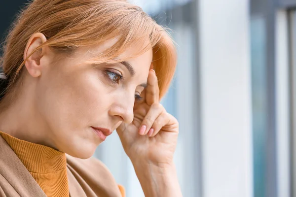 Portrait of depressed woman near window — Stock Photo, Image