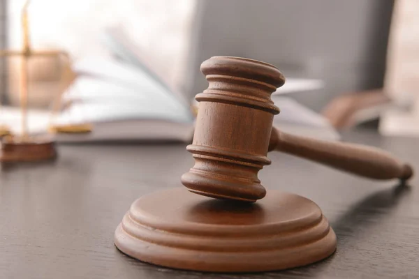 Judge's gavel on table in office — Stock Photo, Image