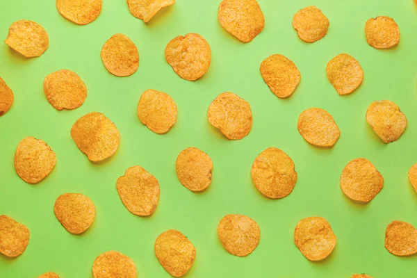 Tasty potato chips on color background — Stock Photo, Image