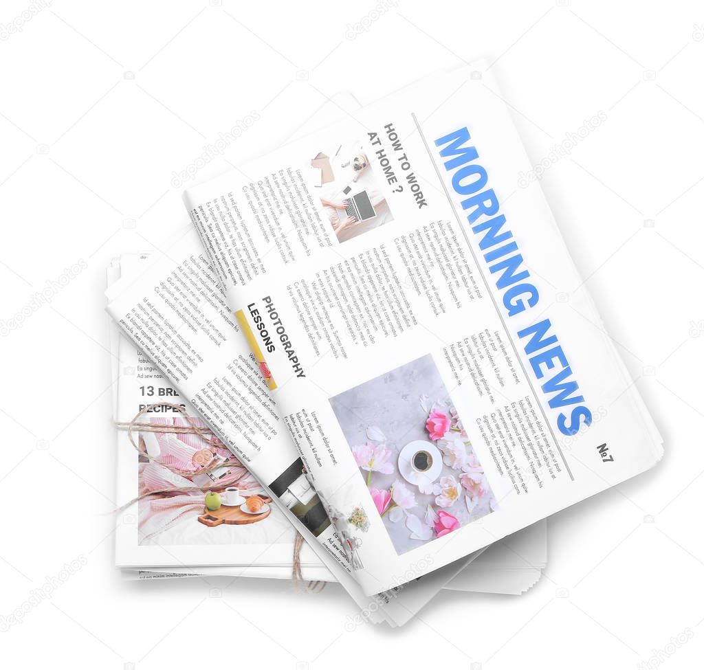 Morning newspapers on white background