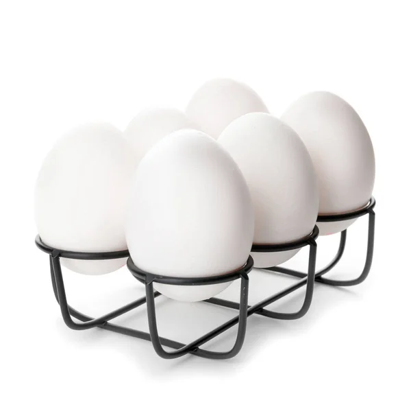 Hållare med färska råa ägg på vit bakgrund — Stockfoto