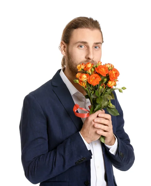 Jóképű férfi, fehér hátterű virágokkal. Valentin-napi ünneplés — Stock Fotó
