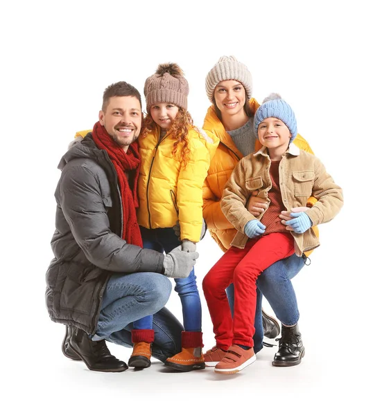 Happy family in winter clothes on white background