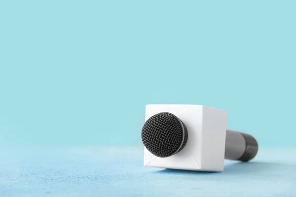 Journalist's microphone on color background — Stock Photo, Image