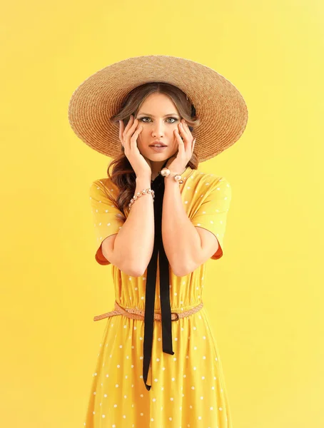 Fashionable young woman on color background — Stock Photo, Image