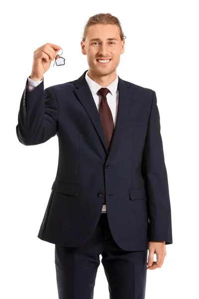 Muž realitní agent s klíčem na bílém pozadí — Stock fotografie