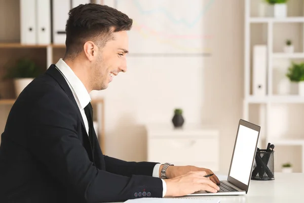 Handsome young businessman working in modern office — Stock Photo, Image