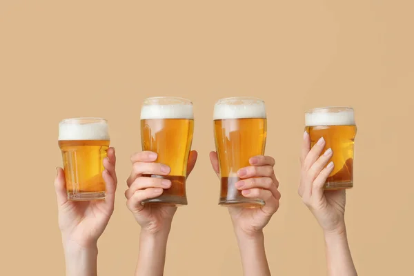 Hands with glasses of beer on color background — Stock Photo, Image