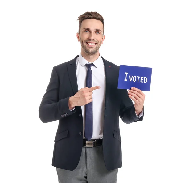 Businessman holding paper with text I VOTED on white background — Stock Photo, Image