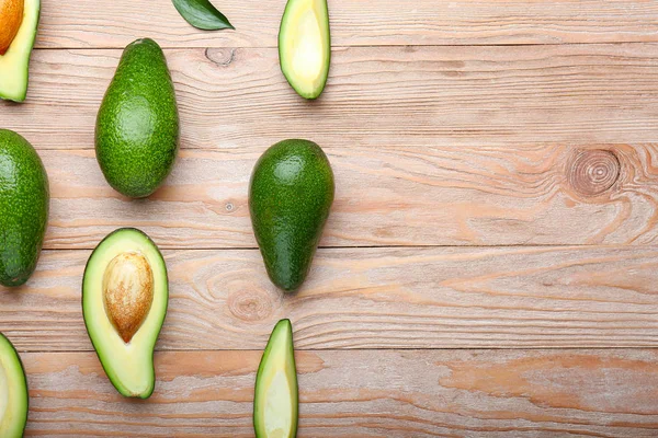Ripe avocados on wooden background — Stock Photo, Image