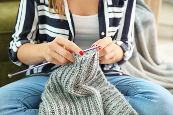 Young woman knitting warm sweater at home, closeup — Stock Photo, Image