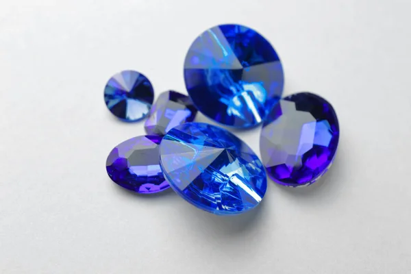 Precious stones for jewellery on light background — Stock Photo, Image