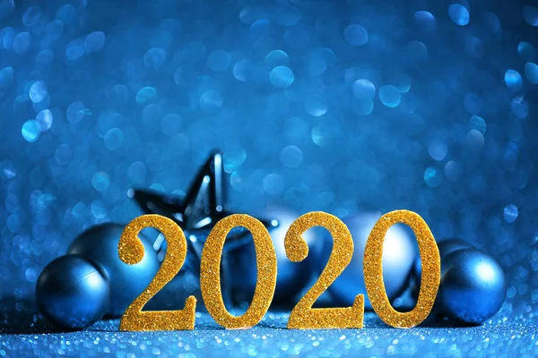 Figure 2020 and Christmas decor on color background — Stock Photo, Image