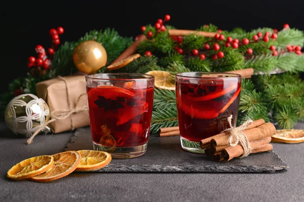 Christmas composition with tasty mulled wine on dark background — Stock Photo, Image