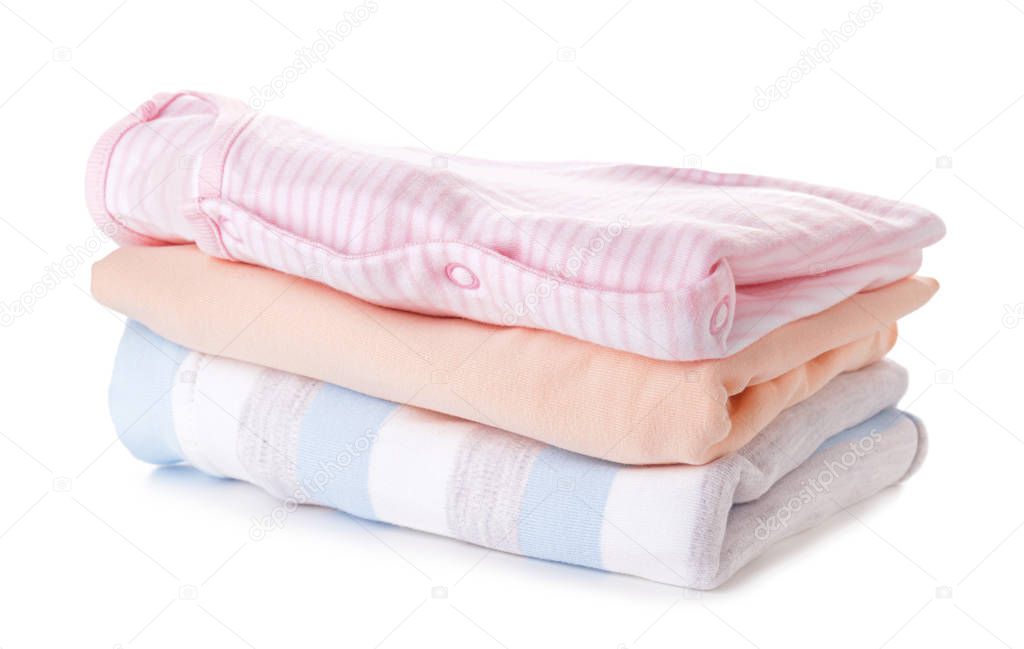 Stack of clean kid clothes on white background