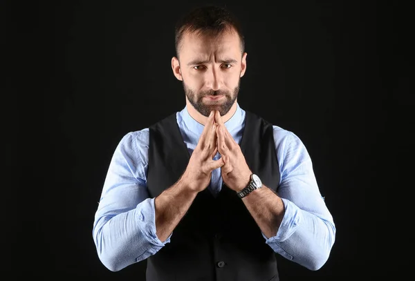 Portrait of stylish young man on dark background — Stockfoto