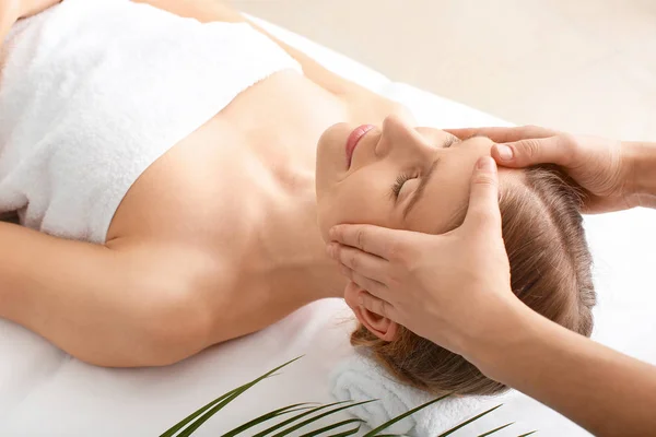 Beautiful woman receiving massage in spa salon — Stock Photo, Image