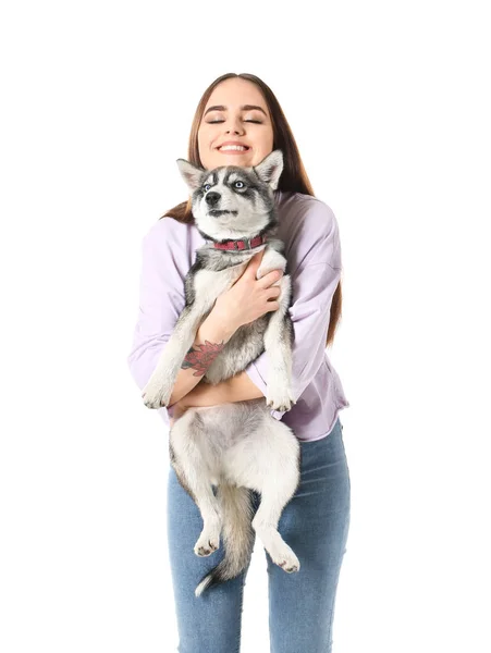 Cute woman with funny husky puppy on white background — Stock Photo, Image