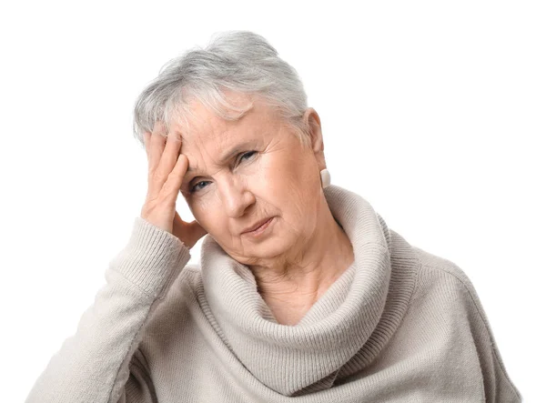 Senior woman suffering from headache on white background — Stock Photo, Image