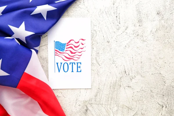 Paper with text VOTE and USA flag on light background — Stockfoto