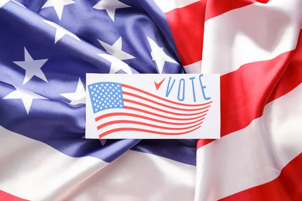 Paper with text VOTE on USA flag — Stock Photo, Image