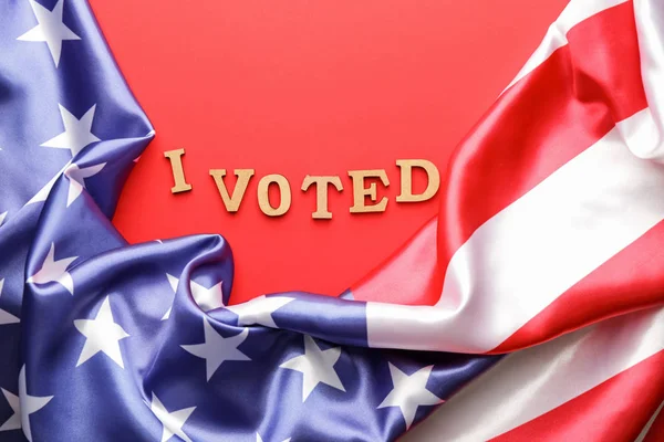 Text I VOTED and USA flag on color background — Stockfoto