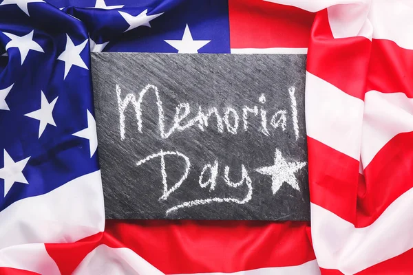 Board with text MEMORIAL DAY on USA flag — Stock Photo, Image