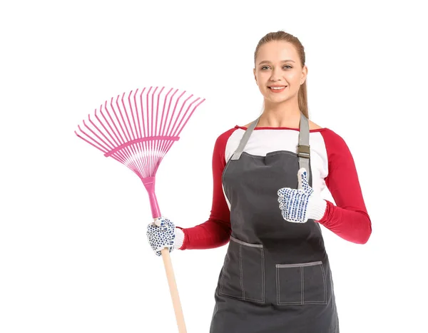 Woman with rake for autumn leaves clean-up on white background — Stock Photo, Image