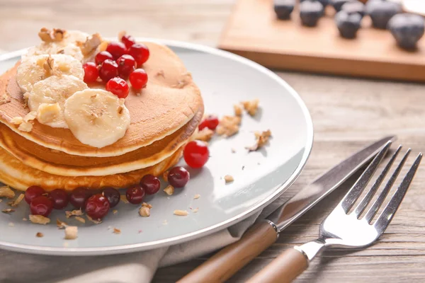Plate with tasty sweet pancakes on table, closeup — Stock Photo, Image