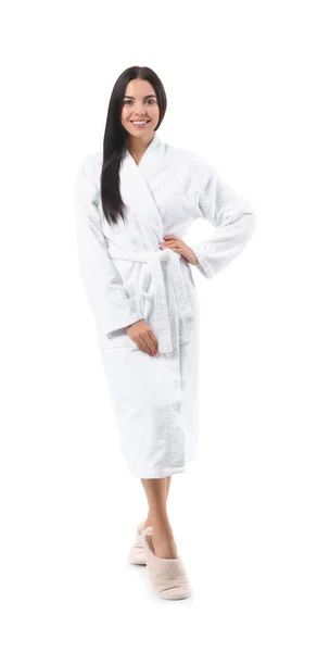Beautiful young woman in bathrobe on white background — Stock Photo, Image