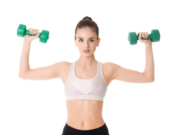 Sporty young woman training with dumbbells against white background — ストック写真