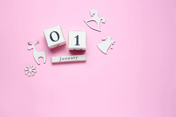 Calendar with date of New Year on color background — Stock Photo, Image