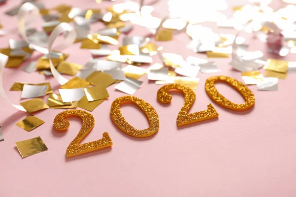 Figure 2020 with confetti on color background. New year celebration — Stock Photo, Image