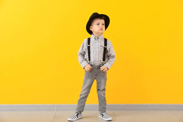 Portrait of stylish little boy against color wall — Stock Photo, Image