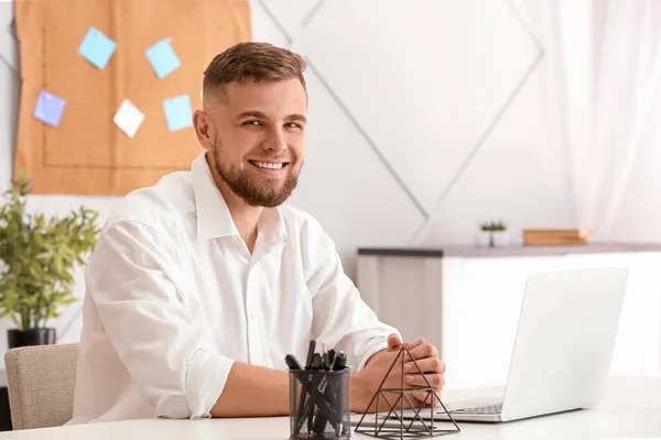 Handsome young businessman working in office — Stock Photo, Image