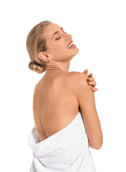 Beautiful young woman wrapped in towel on white background — Stock Photo, Image