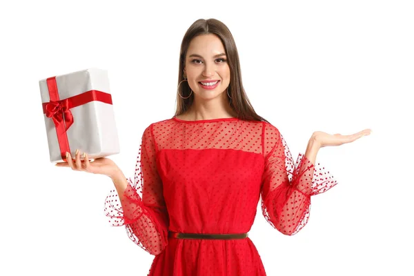 Beautiful young woman with Christmas gift on white background — Stock Photo, Image