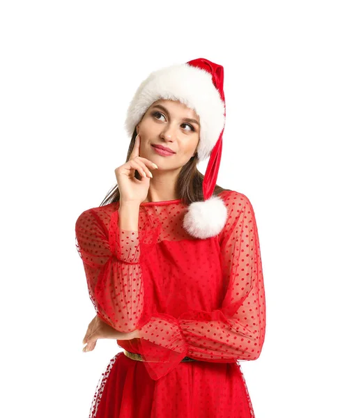 Jovem mulher pensativa em chapéu de Papai Noel no fundo branco — Fotografia de Stock
