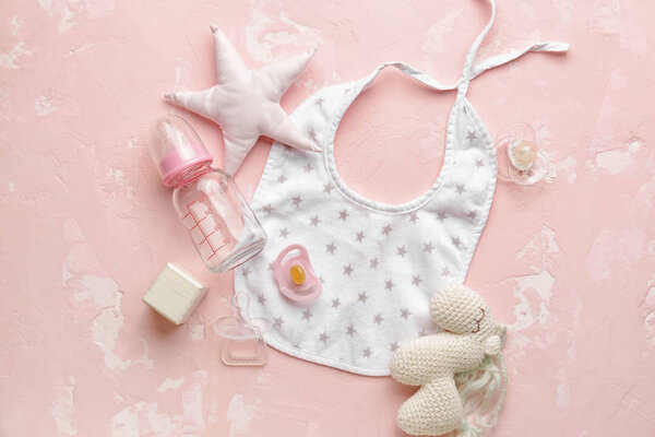 Baby accessories on color background