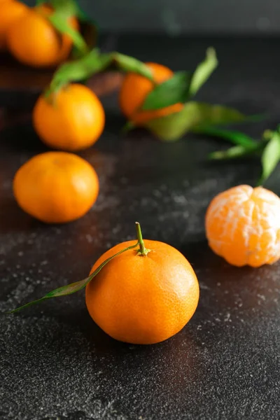 Sweet tangerines on dark table — Stock Photo, Image
