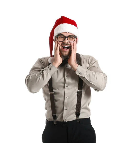 Jeune homme excité dans le chapeau du Père Noël sur fond blanc — Photo