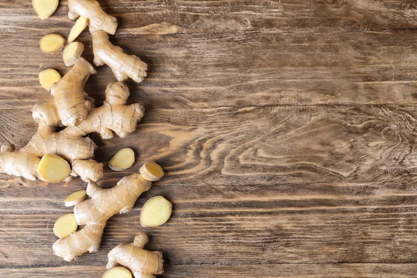 Fresh ginger on wooden table — Stock Photo, Image