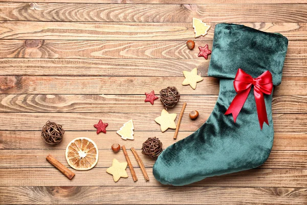 Christmas sock with decor on wooden background — Stock Photo, Image