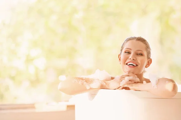 Beautiful young woman taking bath at home — Stock Photo, Image