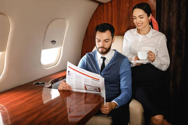Couple on board the modern private airplane — Stock Photo, Image