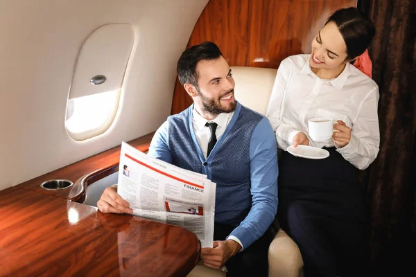 Couple on board the modern private airplane — Stock Photo, Image