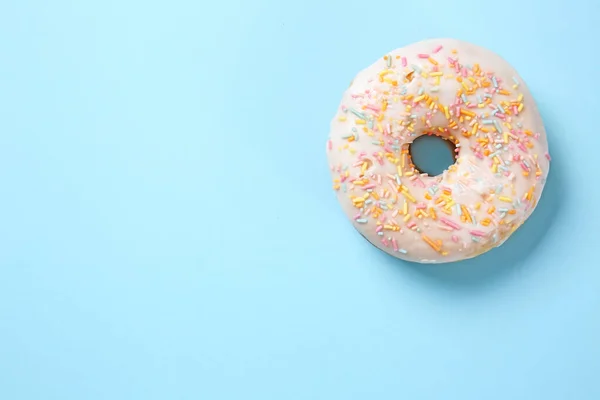 Sweet tasty donut on color background — Stock Photo, Image