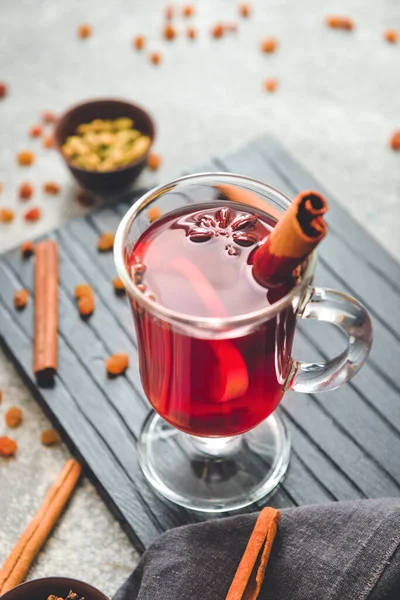 Glass cup of tasty mulled wine on table — Stock Photo, Image