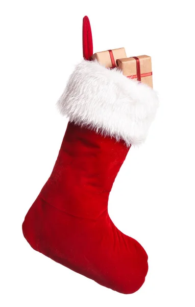 Рождественский носок с подарками на белом фоне — стоковое фото