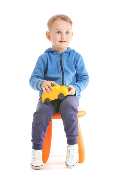 Portrait of cute little boy with toy car on white background — Stock Photo, Image